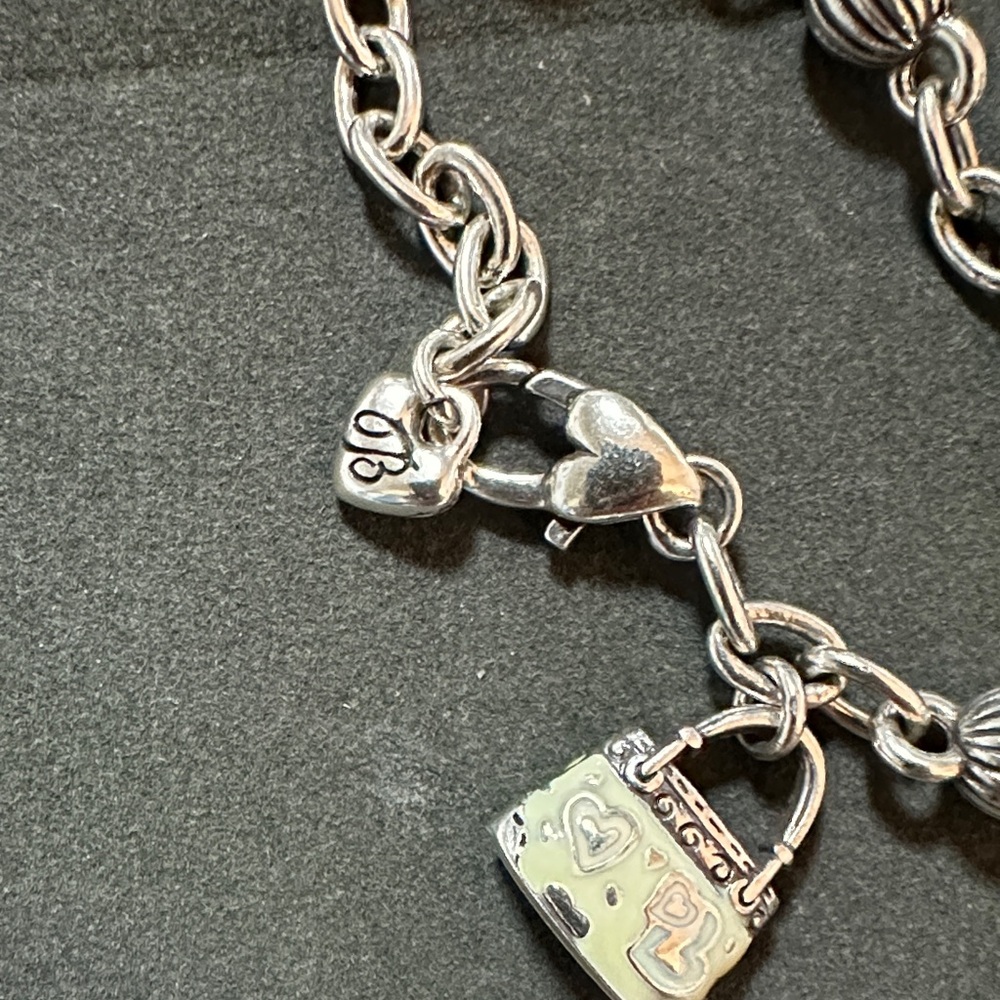 Elegant Silver Bracelet With Heart And Bag Charms View 2